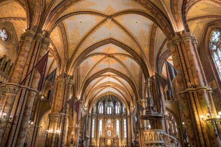 The interior of a cathedral showcasing grand vaulted ceilings